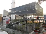 At the entrance to the Value Factory site in Shenzhen, Noreen Heng Liu of Node Architecture designed a restaurant standing on columns above an existing concrete structure.
