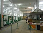 Inside the ferry terminal before the biennale exhibits had been installed. Ferry passengers pass along the right of the space, while biennale visitors will go to the left side of the metal-mesh fence.