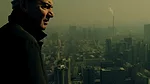 <p>Film Still from <em>REM</em>:</p><p>The architect surveys views from the top of the CCTV Headquarters in Beijing</p>
