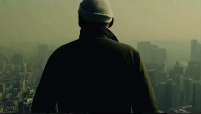 <p>Film Still from <em>REM</em>:</p><p>The architect surveys views from the top of the CCTV Headquarters in Beijing</p>