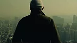 <p>Film Still from <em>REM</em>:</p><p>The architect surveys views from the top of the CCTV Headquarters in Beijing</p>