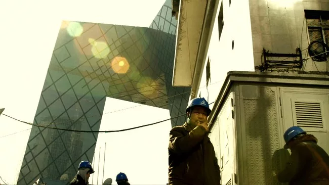 <p>Film Still from <em>REM</em>:</p><p>Workers at the CCTV Headquarters construction site</p>