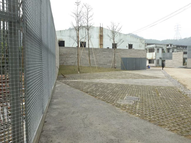 Guangzhou-based O-office Architects is in the process of converting 18 former factory buildings on a 20-acre site into artists’ studios, hotels, a conference center, and more.