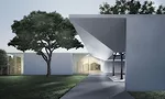 Menil Drawing Institute at dusk, looking past the west entrance courtyard.