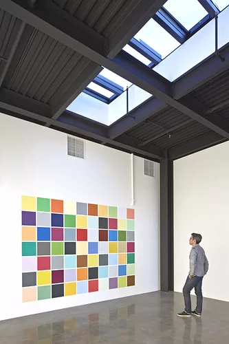 <p>SFMoMA, 242 State Street's first tenant, recruited artist Spencer Finch to create a site-specific work for the interior. The resulting abstract grid of squares is called <a href='http://www.youtube