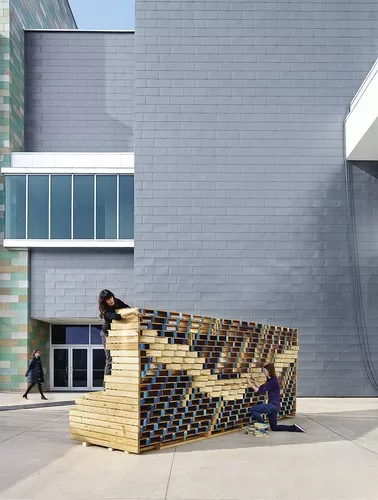 The 18-foot, undulating, plywood <em>Waller Wall</em>, created by architect Murray Legge’s Design 5 studio at The University of Texas at Austin School of Architecture, was filled with more than 