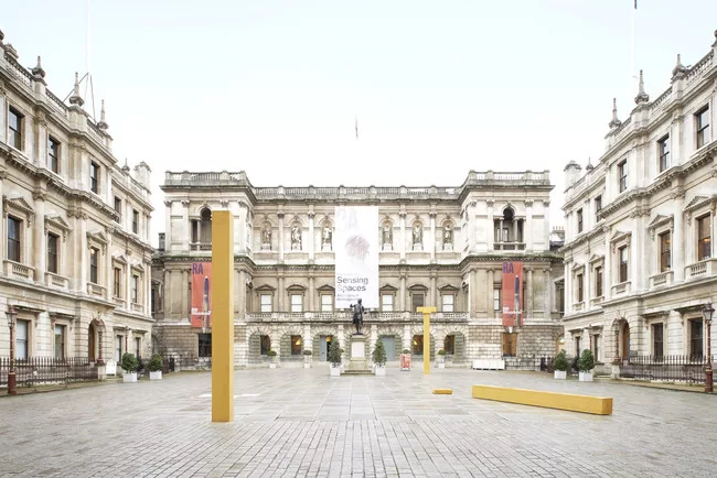 Álvaro Siza's three yellow concrete columns in the gallery’s exterior courtyard.