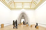 Francis Kéré‘s designed a polypropylene archway into which visitors are encouraged to push plastic straws.