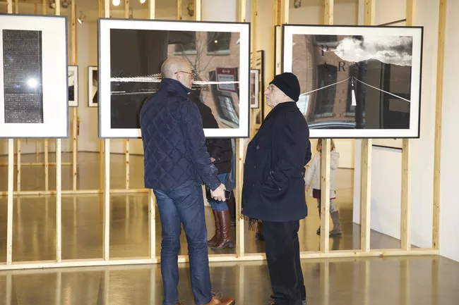 Peter Arnell and Frank Gehry at Milk Gallery, where the architect has curated a show of the businessman's photographs.