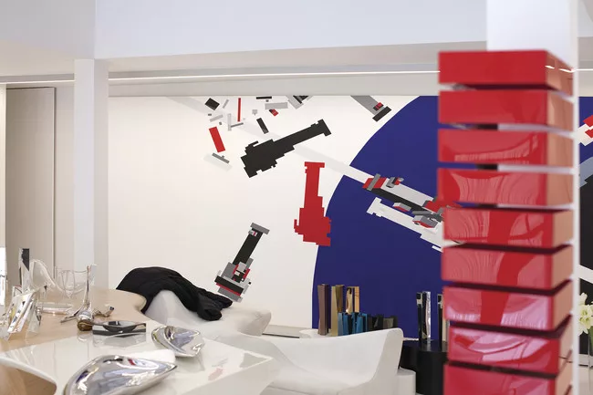 Hadid lives in an open space in London. Some of her early designs, inspired by the revolutionary Russian artist El Lissitzky, hang on the walls.