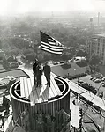 <p class='MsoNormal'>The topping-out ceremony of the tower on October 15, 1949. Jake Stocker, the construction supervisor, is on the right.</p>