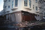 <p class='Standard'>San Francisco, California, October 17, 1989. The damage to the weak, unreinforced garage level of this building at the corner of Beach and Divisadero was typical of the failures se