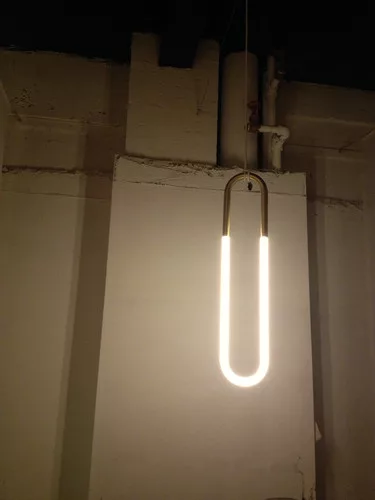 Designed by Lukas Peet, Roll & Hill’s Rudi collection is meant to look like pieces of jewelry, with cold cathode lamps attached to brass-finished metal tubes.