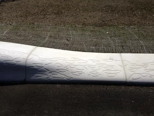 All of the curbs (some raised to become benches) are made of cast concrete.<div id='_mcePaste'>