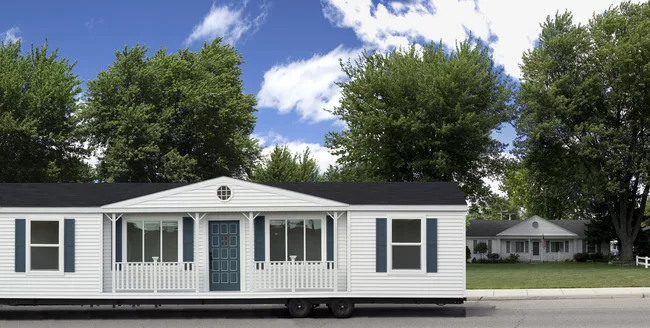 <em>Mobile Homestead</em> parked in front of the original Kelley home on Palmer Road, Westland, Michigan, 2010.