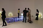 A visitor hops on a power-generating dance floor in the Floor gallery.
