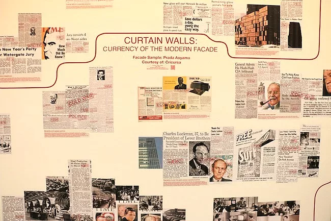 Press clippings and wall text in the Facade gallery.
