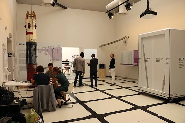 The Elevator gallery notes the role that it had in vertical city growth and suggests that a new model of elevator traveling both horizontally and vertically could change high-rise architecture.
