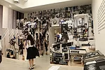 Large photo cutouts of airport security checkpoints in the Door gallery.