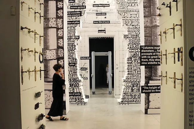 Past a display of historic door handles, 1:1 scale drawings of doors from China, India, and Italy culminate in a modern metal detector.