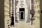Past a display of historic door handles, 1:1 scale drawings of doors from China, India, and Italy culminate in a modern metal detector.