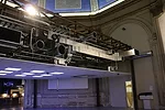 A 1909 painting by Galileo Chini decorates the ceiling of the pavilion. It is partially obscured by its functional, contemporary counterpart, the drop ceiling.