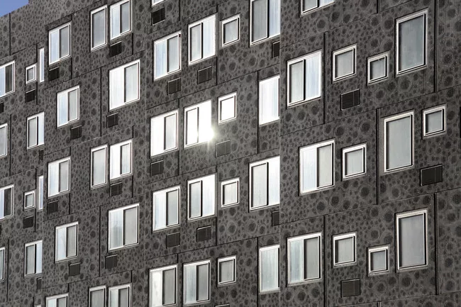 The building is clad with pre-cast concrete panels etched with abstracted images of roses, a famous symbol of Sugar Hill. <br /><div id='_mcePaste'>﻿﻿