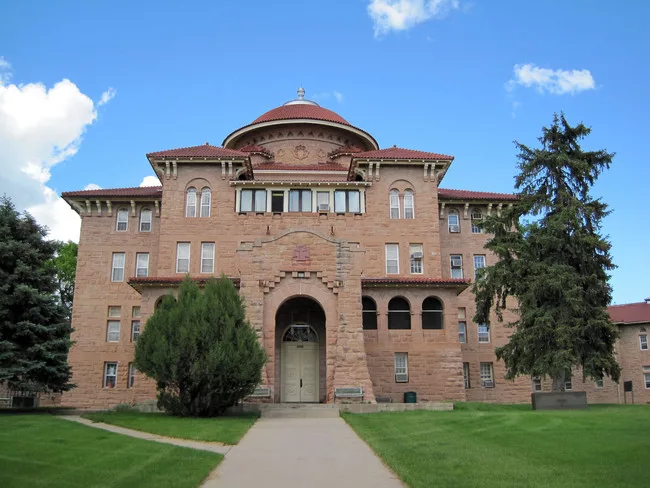 The main administration building of the Battle Mountain Sanitarium in Hot Springs, South Dakota, serves as the entrance to the Mission/Spanish Colonial Revival Style domiciliary.<div id='_mcePaste'>&#