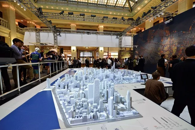 At the Chicago Architecture Foundation's exhibition on big data, a resin model of Chicago has been digitally enhanced to project statistics on everything from demographics to tweets.<div id='_mcePas