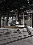Perfromers push models of Frank Gehry's work around the exhibition according to a set of motions choreographed by artist Tino Sehgal.