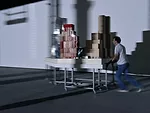 Perfromers push models of Frank Gehry's work around the exhibition according to a set of motions choreographed by artist Tino Sehgal.