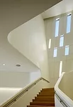A monumental stair connects the three levels.