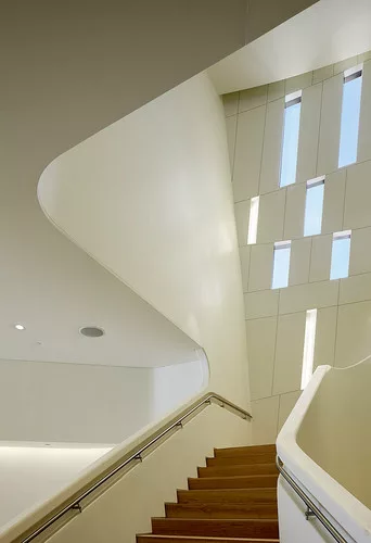 A monumental stair connects the three levels.