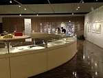 <p>The exhibition materials are displayed in a series of  curved vitrines that form a circle within the main room of the Archives  building.</p><div id='_mcePaste'>﻿﻿