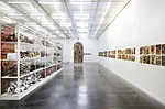 Hassan Sharif's <em>Suspended Objects</em> (2011), center, with Hassan Sharif's  surplus materials and found objects, shown at left, and Abdullah Al Saadi's <em>Camar Cande’s Journey</em> (