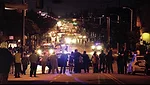 A crowd gathered at the intersection of Western and Adams Boulevards in South Central Los Angeles watched the boulder make its way to LACMA.