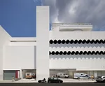 Emergency vehicles pull into a bay on the building's southern side.