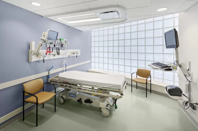 Perkins Eastman replaced the 8-by-8-inch glass bricks in the podium, which bring soft daylight into some exam rooms. The curved glass walls create bigger rooms too.<br /><div id='_mcePaste'>&