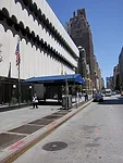 As the O’Toole building, the building had a podium surrounded by a fence and an inhospitable entrance canopy.