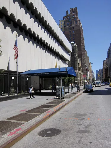 As the O’Toole building, the building had a podium surrounded by a fence and an inhospitable entrance canopy.