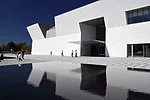 The geometric mashrabiya pattern printed on the glass walls of the interior courtyard cast intricate shadows inside the museum.