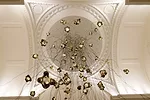 Contemporary handmade chandeliers by Canadian studio Bocci were on display at the Mayfair premises of traditional antiques dealer Mallett.
