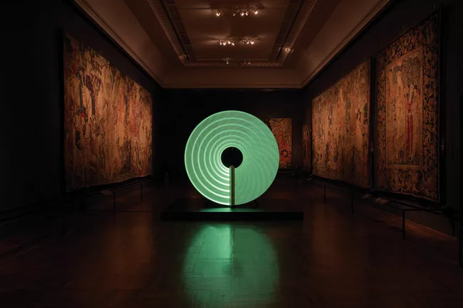 Created by graphic designer Michael Montgomery, product designer Felix de Pass, and ceramicist Ian McIntyre, the hypnotic Candela cleverly responded to the requirements of its site, a V&A tapestry gal