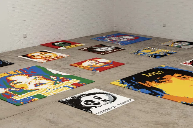 For <em>Trace</em>, the artist paved the large concrete hall of the New Industries Building with 176 Lego portraits of political exiles and prisoners.