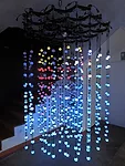 The light chandelier in <em>Domus</em> measures is suspended from the apex of the yurt. The LED lights emit light pulses in response to real-time seismic data.