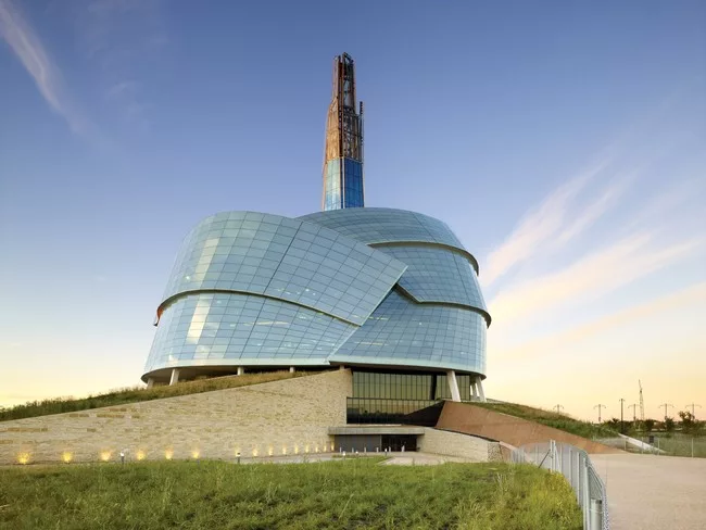 Visitors enter through the museum’s base, walking past the Roots, sloping structures meant to represent humanity’s link to the earth. The Roots contain classrooms, ticketing, a restaurant,