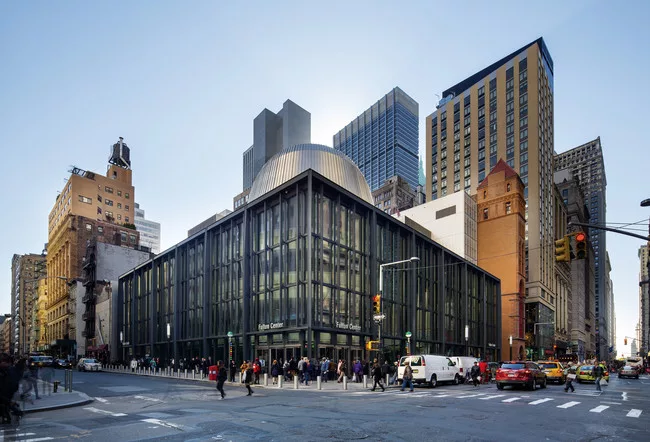 The Fulton Center's metal-clad oculus can be seen emerging from Grimshaw’s steel and glass station. The 125-year-old Corbin building, to the right of the station, was renovated and provides anot