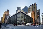 The Fulton Center's metal-clad oculus can be seen emerging from Grimshaw’s steel and glass station. The 125-year-old Corbin building, to the right of the station, was renovated and provides anot