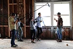 The film crew, including Bassett (center) talks to John Boiler, CEO of 72andSunny, a design and advertising agency.<div id='_mcePaste'>﻿﻿