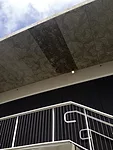 Up one of the escalators from the Palm Court is an event space by Aranda\Lasch with a cantilevered roof, a post-tensioned concrete slab bearing geometric patterns in relief.<div id='_mcePaste'>﻿